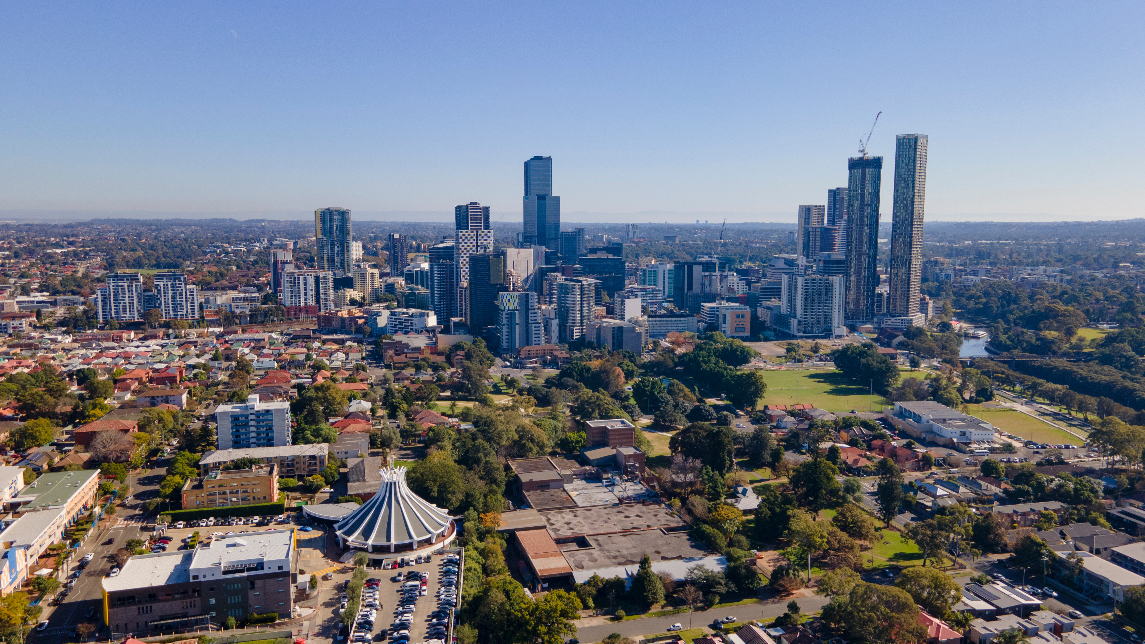 Panoramic aerial drone view of Parramatta CBD in Greater Western Sydney, NSW, Australia showing development of the city